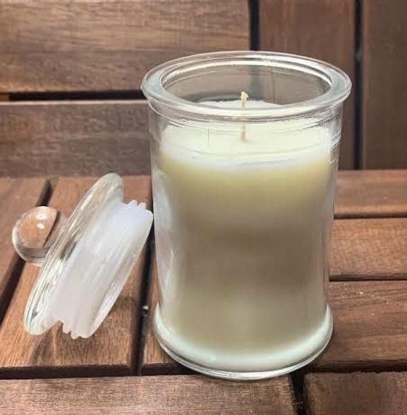 French Vanilla scented Medium Soy Wax Candle in clear glass jar with lid.